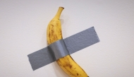 File: Italian visual artist Maurizio Cattelan's duct-taped banana entitled 