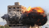 Fire and smoke erupt from a building just after an Israeli airstrike in Beirut's southern Shayah neighbourhood on November 22, 2024. (Photo by AFP)