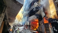 Firefighters battle the flames after a building was hit in an Israeli airstrike in the Haret Hreik neighbourhood of Beirut's souther suburbs on November 23, 2024. (Photo by AFP)