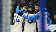 Chelsea's Argentinian midfielder #08 Enzo Fernandez (C) celebrates with teammates after scoring their second goal during the English Premier League football match between Leicester City and Chelsea at King Power Stadium in Leicester, central England on November 23, 2024. (Photo by JUSTIN TALLIS / AFP)