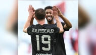 Al Duhail's Homam Al Amin (right) celebrates with teammate Benjamin Bourigeaud after scoring a goal against Al Arabi.