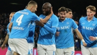 Napoli's Belgian forward #11 Romelu lukaku celebrates scoring his team's first goal with teammates during the Italian Serie A football match between Napoli and Roma at the Diego Armando Maradona stadium in Naples on November 24, 2024. (Photo by Carlo Hermann / AFP)