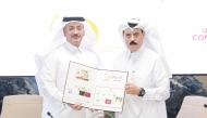 Board Member of Commercial Bank, Abdul Rahman bin Hamad Al Attiyah, and Chairman and Managing Director of Qatar Post, Faleh bin Mohammed Al Naemi during the press conference, on November 24, 2024.  