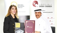 General Manager of Qatar Chamber Ali Busharbak Al Mansouri and OBG’s Country Director for Qatar Fernanda Braz during the MoU signing. 