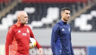 Al Nassr's Cristiano Ronaldo (right) attends a training session on November 24, 2024.