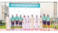 Qatar's golfers pose for a group photo with officials. 