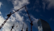 Photo used for representation purposes. Clouds cover the sky as cranes operate at a building and construction site close to the TV tower (C) and Park Inn Hotel (R) at Alexanderplatz square in Berlin, Germany on November 22, 2024. Photo by Tobias SCHWARZ / AFP.