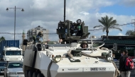 A United Nations Interim Force in Lebanon (UNIFIL) armoured vehicle drives through the southern Lebanese city of Sidon on November 25, 2024. (Photo by Mahmoud Zayyat / AFP)