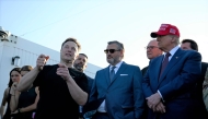 Elon Musk speaks with US President-elect Donald Trump and guests at a viewing of the launch of the sixth test flight of the SpaceX Starship rocket on November 19, 2024 in Brownsville, Texas. (Photo by Brandon Bell / Getty Images via AFP)