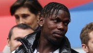 (FILES) French midfielder paul Pogba (L) attends the UEFA Euro 2024 round of 16 football match between France and Belgium at the Duesseldorf Arena in Duesseldorf on July 1, 2024. (Photo by FRANCK FIFE / AFP)