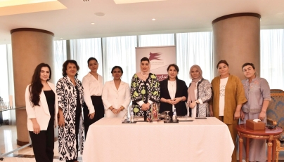 Vice Chairwoman of QBWA Aisha Alfardan, Chairman of the Surkhandarya region Oydin Sharafiddinova with other officials during signing of the MoU.