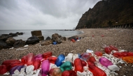 The photo taken on November 25, 2024 shows plastic fishing floats and other debris being washed up along the shore of the Miaodao archipelago in Yantai, in eastern China's Shandong province. (Photo by Jade Gao / AFP) 