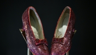 The ruby slippers worn by US actress and singer Judy Garland in the 1939 film The Wizard of Oz are pictured on display in London on November 27, 2024. (Photo by Justin Tallis / AFP)