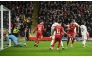 Liverpool's Dutch striker #18 Cody Gakpo (2R) celebrates scoring the team's second goal during the UEFA Champions League football match between Liverpool and Real Madrid at Anfield in Liverpool, north west England on November 27, 2024. (Photo by Oli SCARFF / AFP)
