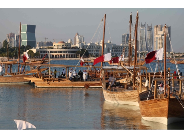 Traditional wooden boats sail during the 14th Traditional Dhow Festival at the Katara Cultural Village Foundation in Doha on November 27, 2024. (Photo by Karim Jaafar / AFP)