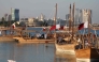 Traditional wooden boats sail during the 14th Traditional Dhow Festival at the Katara Cultural Village Foundation in Doha on November 27, 2024. (Photo by Karim Jaafar / AFP)