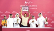 The connections of Dubawi Spectre celebrate after winning the Doha Cup. QREC Racing Manager Abdulla Rashid Al Kubaisi crowned the winners. Pic: Juhaim/QREC