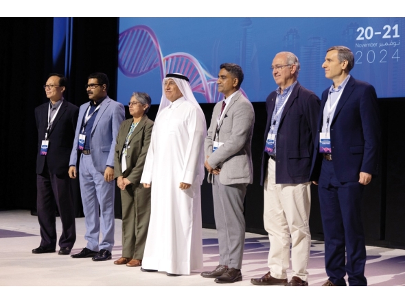 President of UDST Dr. Salem Al Naemi (centre) with other participants during the event.