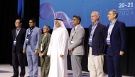 President of UDST Dr. Salem Al Naemi (centre) with other participants during the event.