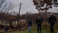 Kosovo police and security officers stand next to a site damaged by an explosion in the village of Varage near the town of Zubin Potok on November 30, 2024. Photo by Armend NIMANI / AFP.