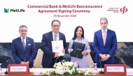 Commercial Bank, MetLife officials during the agreement signing ceremony.