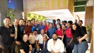 Nando’s co-founder Robbie Brozin, John Sikiotis (CEO of Nando’s Licensed Markets & India), and Vyanktesh Jaiswal (COO of Oryx Group for Food Services) pose for a group photo with the employees.