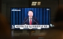 South Korea's President Yoon Suk Yeol is seen speaking on a television in a train station in Seoul late on December 3, 2024, after he declared emergency martial law, saying the step was necessary to protect the country from 