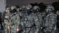 Soldiers try to enter the National Assembly building in Seoul on December 4 2024, after South Korea President Yoon Suk Yeol declared martial law. South Korea's President Yoon Suk Yeol on December 3 declared martial law, accusing the opposition of being 