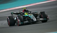 Mercedes' British driver Lewis Hamilton drives during the qualifying session ahead of the Abu Dhabi Formula One Grand Prix at the Yas Marina Circuit in Abu Dhabi on December 7, 2024. (Photo by Giuseppe CACACE / AFP)
