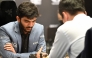 India's grandmaster Gukesh Dommaraju (L) competes against China's chess grandmaster Ding Liren in game 14 of the 2024 FIDE World Championship in Singapore on December 12, 2024. (Photo by Simon Lim / AFP)
