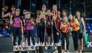 The podium winners of the Queen & King of the Court Beach Volleyball Finals Doha 2024 celebrate on the podium.