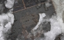 A photograph taken on January 5, 2025, shows Snows of pavement outside Anfield in Liverpool, north west England on January 5, 2025. (Photo by Darren Staples / AFP) 