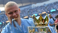 Manchester City's Norwegian striker #09 Erling Haaland poses with the Premier League trophy after the presentation ceremony following the English Premier League football match between Manchester City and West Ham United at the Etihad Stadium in Manchester, north west England, on May 19, 2024. Photo by Oli SCARFF / AFP