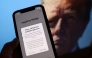 This illustration photo taken in Los Angeles on January 18, 2025, shows the TikTok app on a smartphone screen in front of a photo of US President-elect Donald Trump. Photo by Chris Delmas/ AFP