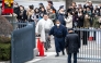 People gather at the entrance of Ryogoku Kokugikan for the arrival of sumo wrestlers during the Grand Sumo Tournament in Tokyo on January 19, 2025. (Photo by Philip Fong / AFP)