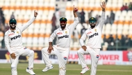 Pakistan's Sajid Khan (C) celebrates with Mohammad Rizwan (L) and Babar Azam after taking a five-wicket haul at the Multan Cricket Stadium in Multan on January 19, 2025. (Photo by Aamir Qureshi / AFP)