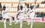 Pakistan's Sajid Khan (C) celebrates with Mohammad Rizwan (L) and Babar Azam after taking a five-wicket haul at the Multan Cricket Stadium in Multan on January 19, 2025. (Photo by Aamir Qureshi / AFP)