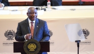 South African President Cyril Ramaphosa delivers the State of the Nation address at the Cape Town City Hall on February 6, 2025. (Photo by Rodger Bosch / AFP)
