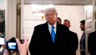 US President Donald Trump arrives to speak to reporters in Washington, DC, on February 11, 2025. (Photo by Allison Robbert / AFP)