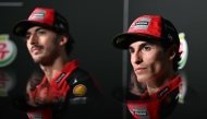 Ducati Lenovo's Italian rider Francesco Bagnaia (L) and Ducati Lenovo's Spanish rider Marc Marquez (R) take part in a press conference ahead of the MotoGP Thailand Grand Prix at the Buriram International Circuit in Buriram on February 27, 2025. (Photo by MOHD RASFAN / AFP)