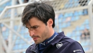 Williams' Spanish driver Carlos Sainz walks in the pits on the second day of the Formula One pre-season testing at the Bahrain International Circuit in Sakhir on February 27, 2025. (Photo by Giuseppe CACACE / AFP)