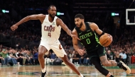 Jayson Tatum #0 of the Boston Celtics drives past Evan Mobley #4 of the Cleveland Cavaliers during the first quarter at TD Garden on February 28, 2025 in Boston, Massachusetts. (Photo by Maddie Meyer / GETTY IMAGES NORTH AMERICA / Getty Images via AFP)
