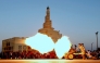 The 'iftar' cannon is fired to signal sunset and the end of fasting at Souq Waqif in Doha on March 12, 2024. Photo by Karim Jaafar / AFP.