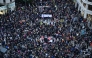 People gather during a demonstration to protest the regional government's response and call for the resignation of Valencia regional president Carlos Mazon, four months after devastating floods in Valencia, eastern Spain, on March 01, 2025. (Photo by JOSE JORDAN / AFP)
