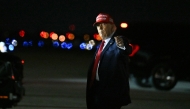 US President Donald Trump gestures after landing at the Palm Beach International Airport in West Palm Beach, Florida, on February 28, 2025. (Photo by Roberto Schmidt / AFP)