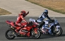 Winner Ducati Lenovo's Spanish rider Marc Marquez (L) and second-placed BK8 Gresini Racing MotoGP's Spanish rider Alex Marquez (R) celebrate after the MotoGP Thailand Grand Prix at the Buriram International Circuit in Buriram on March 2, 2025. (Photo by MOHD RASFAN / AFP)