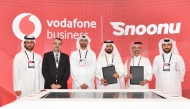 Acting EBU Director at Vodafone Qatar, Mohamed Mohsin Alyafei and Founder and CEO at Snoonu, Hamad Alhajri with other officials during the signing ceremony.