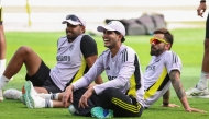 India's Shubman Gill (C) and Virat Kohli (R) join the team during a practice session in Dubai on March 8, 2025. (Photo by Fadel Senna / AFP)