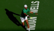 Novak Djokovic of Serbia returns a shot to Botic van de Zandschulp Netherlands during the BNP Paribas Open at Indian Wells Tennis Garden on March 08, 2025 in Indian Wells, California. Matthew Stockman/Getty Images/AFP