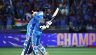 India's KL Rahul (left) and Ravindra Jadeja celebrate their victory at the end of the ICC Champions Trophy one-day international (ODI) final cricket match between India and New Zealand at the Dubai International Stadium in Dubai on March 9, 2025. (Photo by Fadel Senna / AFP)